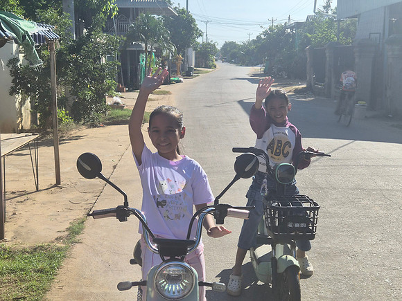 Young Girls On motor scooters silk Island Cambodia
