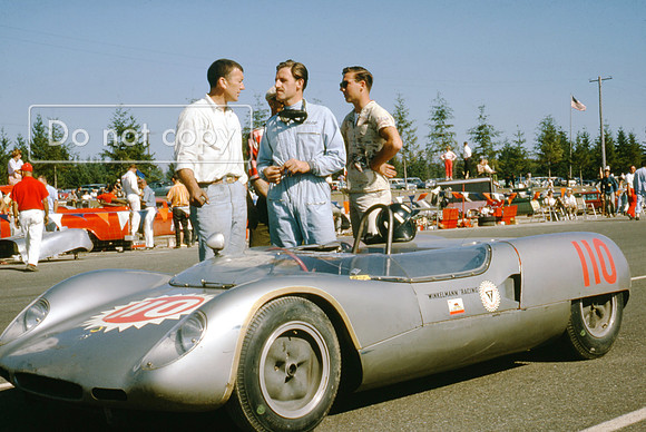 Graham Hill standing beside the Bob Winklemann Lotus 23b Pacific North West Grand Prix Kent 1963