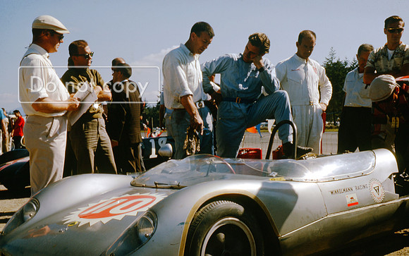 Graham Hill beside the Bob Winklemann Lotus 23b Pacific North West Grand Prix Kent 1963